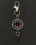 Gothic chainmail keychain with red glass core and steel spike pendant