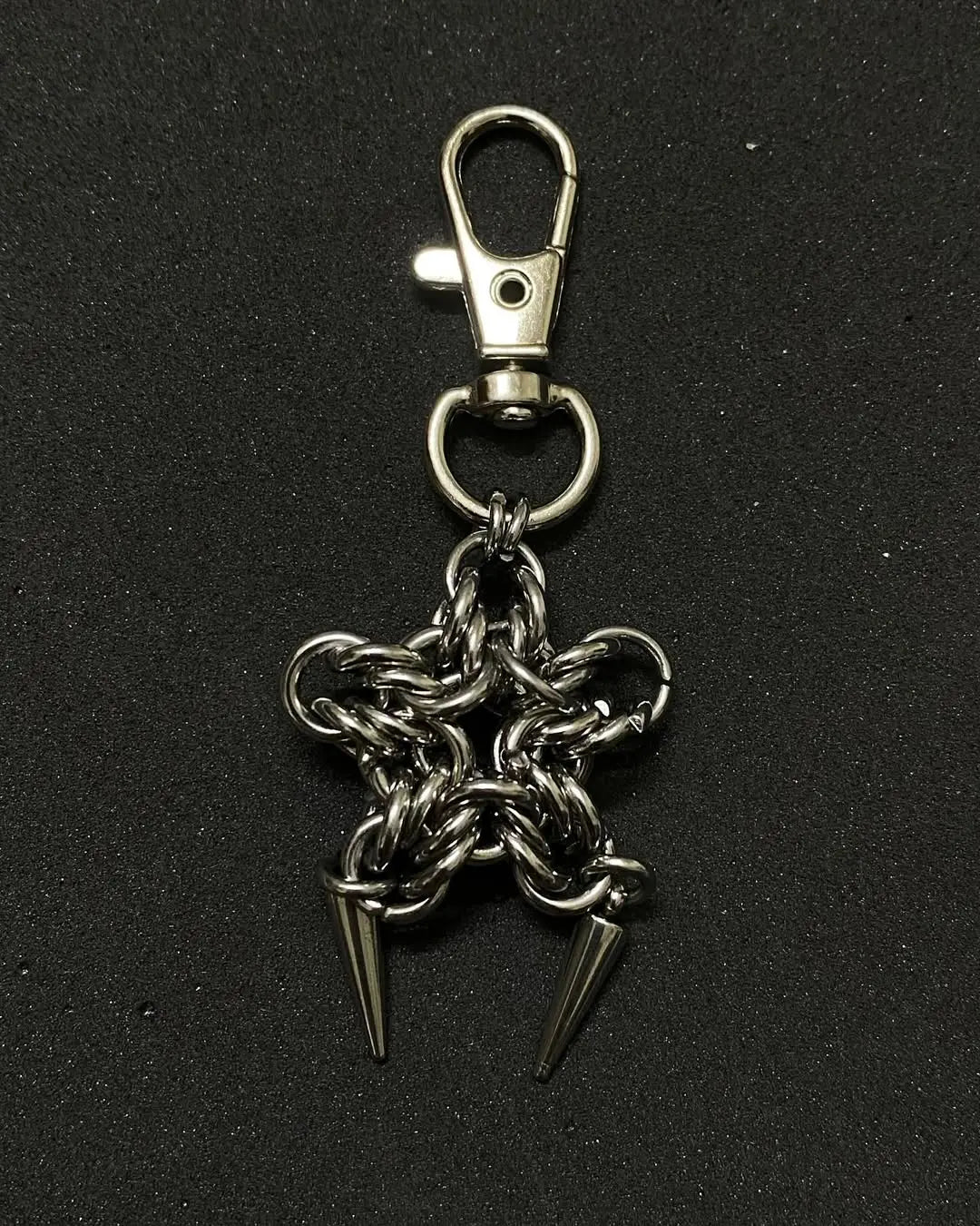 Gothic chainmail star keychain with dual spike charms in stainless steel